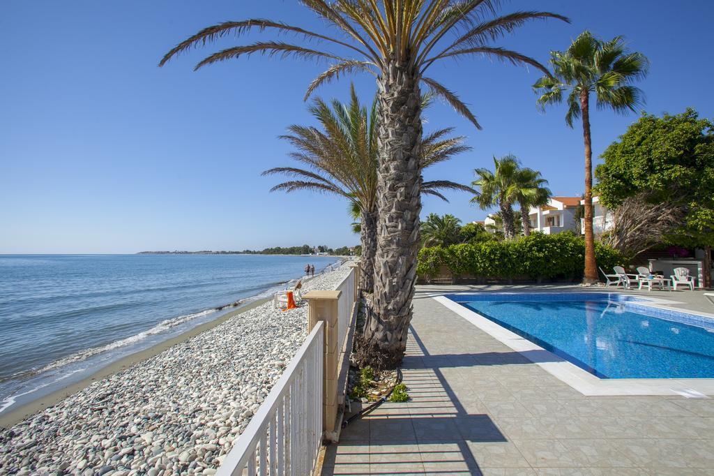 Meneou Beachfront Villa Sunset Перволія Номер фото